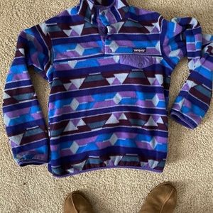 Blue and purple Pategonia. Either Adult xs or youth large